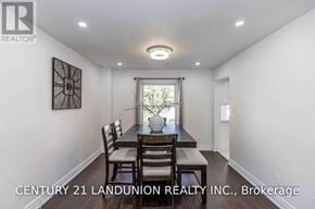 Barrie (West Bayfield) apartment for rent - A dining room with a table set for two and a painting on the wall.