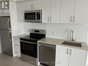 Toronto (Humber Heights) condo for rent - A kitchen with a stainless steel refrigerator, microwave, oven, and sink.