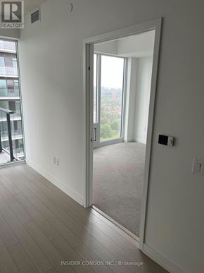 Toronto (Humber Heights) condo for rent - A room with a door leading to a balcony.