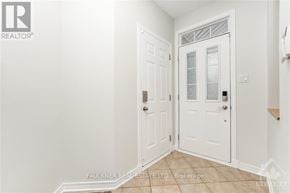 Ottawa apartment for rent - A white door with a glass panel is in a room with white walls.