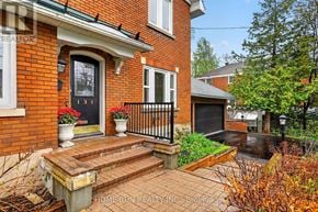 Ottawa apartment for rent - A brick house with a black gate and a number 131 on the door.