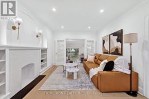Ottawa apartment for rent - A modern living room with a fireplace and a brown couch.