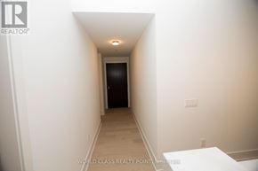 Toronto (Annex) condo for rent - A hallway with a door at the end.