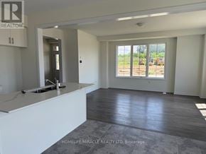 Brantford apartment for rent - A realtor's office with a view of a construction site outside the window.