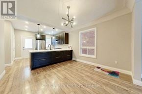 Hamilton (Gibson) apartment for rent - A well-lit kitchen with dark wood floors and a large island.