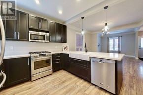 Hamilton (Gibson) apartment for rent - A modern kitchen with dark brown cabinets and stainless steel appliances.