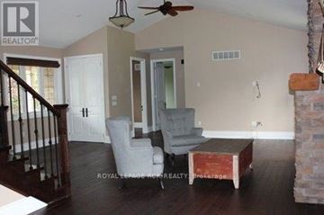 King (King City) apartment for rent - A living room with a grey couch and a wooden coffee table.