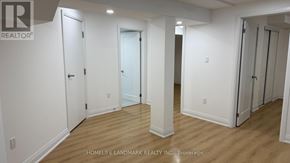 Markham (Middlefield) apartment for rent - A white hallway with doors on both sides and a brokerage logo in the top left corner.