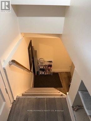Brampton (Brampton South) apartment for rent - A staircase with a black mat on the bottom step.