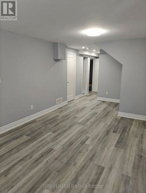 Cambridge apartment for rent - A room with wooden flooring and white walls.