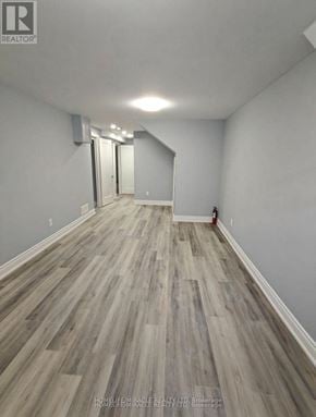 Cambridge apartment for rent - A room with wooden flooring and white walls.