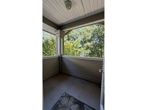 Surrey townhouse for rent - A sunroom with a view of trees.