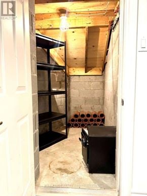 Toronto (Princess-Rosethorn) apartment for rent - A room with exposed ceiling beams and a wooden floor.