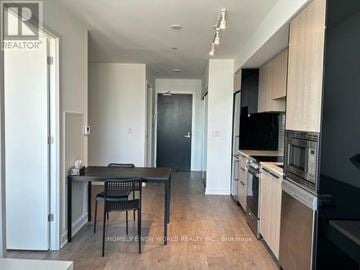 Toronto (Church-Yonge Corridor) condo for rent - A kitchen with a table and chairs in the middle of the room.