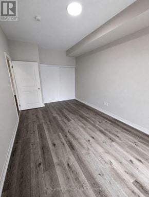 St. Catharines (E. Chester) condo for rent - A room with wooden flooring and white walls.
