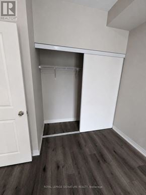 St. Catharines (E. Chester) condo for rent - A white closet with a door and a shelf.