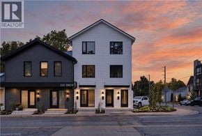 Dundas apartment for rent - A modern two-story house with a realtor logo on the top left corner.
