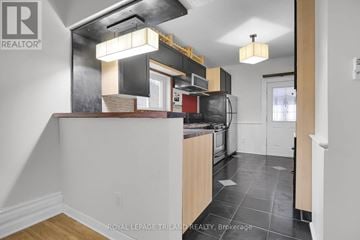 London South (South F) apartment for rent - A kitchen with a white counter top and a black stove top oven.