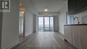 Toronto (Newtonbrook West) condo for rent - A spacious kitchen with a sink and a window overlooking the balcony.
