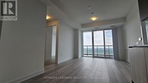 Toronto (Newtonbrook West) condo for rent - A spacious room with a view of the outdoors through large windows.