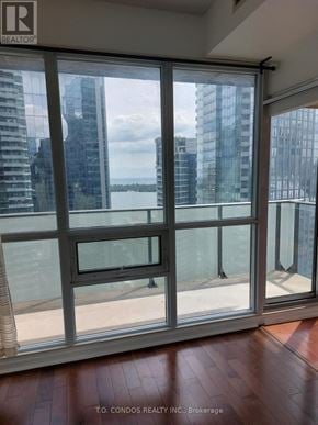 Toronto (Waterfront Communities) condo for rent - A view of a cityscape through a large window.