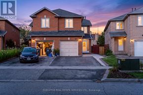 Mississauga (Hurontario) apartment for rent - A house with a car parked in front of it.