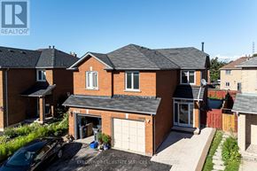 Mississauga (Hurontario) apartment for rent - A house with a car parked in front of it.