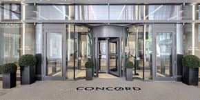 Toronto (Waterfront Communities) condo for rent - The front of a building with the word Concord written on the ground.