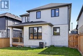 East Luther Grand Valley (Grand Valley) apartment for rent - A house with a grey roof and a wooden fence in front.