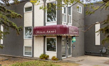 Edmonton apartment for rent - A building with a red awning that says Regal Arms.