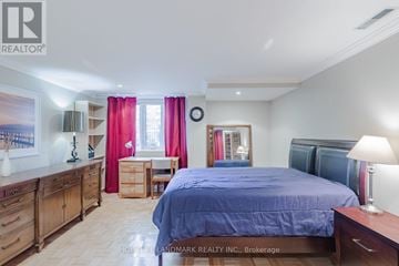 Toronto (Mimico) townhouse for rent - A bedroom with a bed, dresser, and desk.