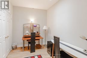 Toronto (Mimico) townhouse for rent - A room with a desk, chair, and a bathtub.