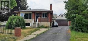 Kitchener apartment for rent - A house with a black car in front of it.