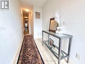 Welland (Lincoln/Crowland) apartment for rent - A hallway with a rug and a glass table with a picture frame on it.