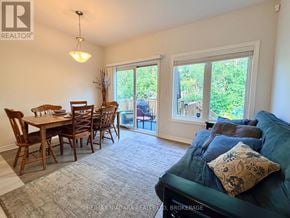 Welland (Lincoln/Crowland) apartment for rent - A living room with a couch, chairs, and a dining table.