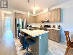 Welland (Lincoln/Crowland) apartment for rent - A kitchen with a large island and modern appliances.
