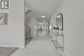London South (South V) apartment for rent - A hallway with a marble floor and white walls.