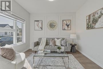 London South (South V) apartment for rent - A well-lit living room with a grey sofa and a glass coffee table.
