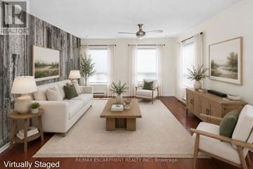 Hamilton (Rymal) apartment for rent - A living room with a white couch, wooden coffee table, and a painting on the wall.