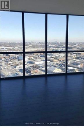 Vaughan (Concord) condo for rent - A view of a city from a high vantage point through a window.