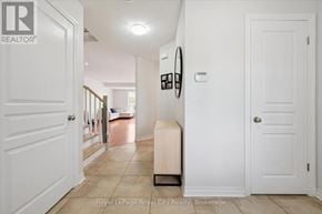 Guelph (Pineridge/Westminster Woods) townhouse for rent - A hallway with a white door and a white wall.
