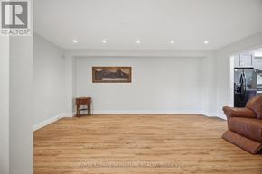 Brampton (Sandringham-Wellington) apartment for rent - A room with wooden flooring and a painting on the wall.