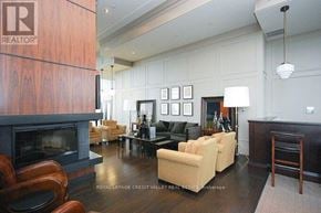 Mississauga (City Centre) condo for rent - A living room with a fireplace and a couch.