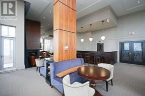 Mississauga (City Centre) condo for rent - A large room with a table and chairs in the middle.