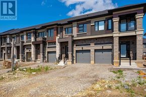 Brantford townhouse for rent - A row of new houses with garages are for sale.