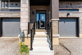 Brantford townhouse for rent - The entrance to a building with a sign that reads "REALTOR".