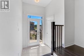 Brantford townhouse for rent - A white interior room with a door leading to a balcony.