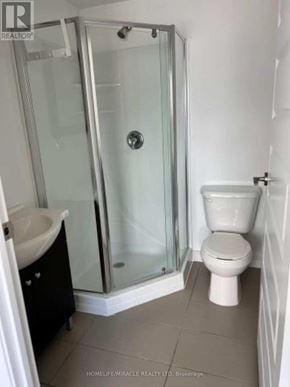 Waterloo condo for rent - A bathroom with a toilet, sink and shower.