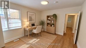 Waterloo apartment for rent - A room with a window and wooden flooring.