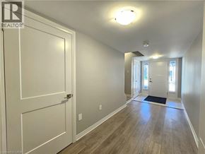 Cambridge townhouse for rent - A hallway with a white door and a light on the ceiling.